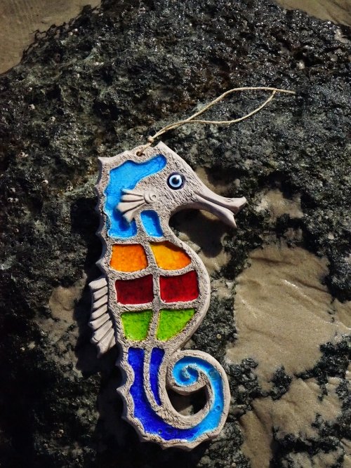 Coloured Seahorse Garden Ornament on rocks
