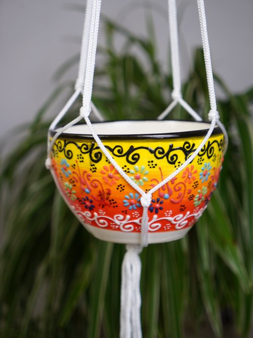 sunset hand painted hanging pot with plant