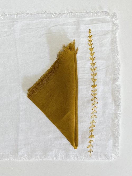 golden frayed french linen napkin folded